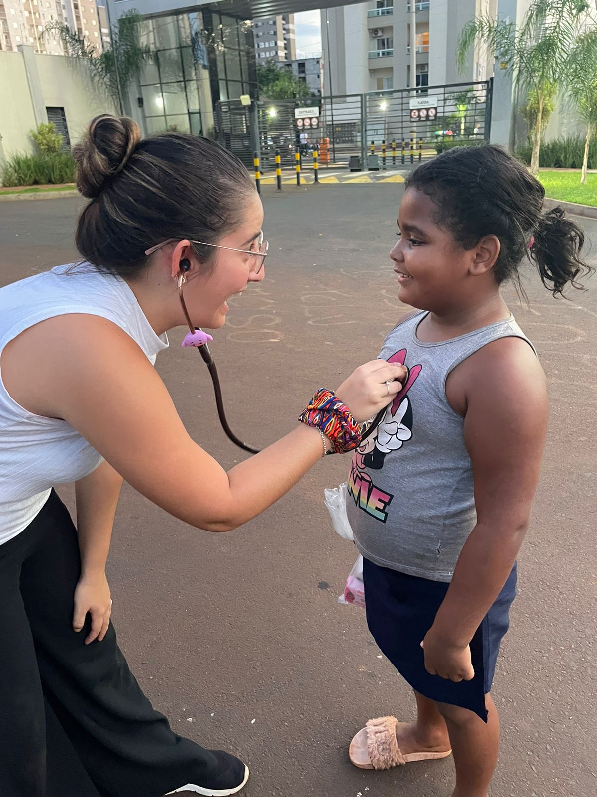 A Hearts for the Homeless volunteer handing supplies to a person during street outreach