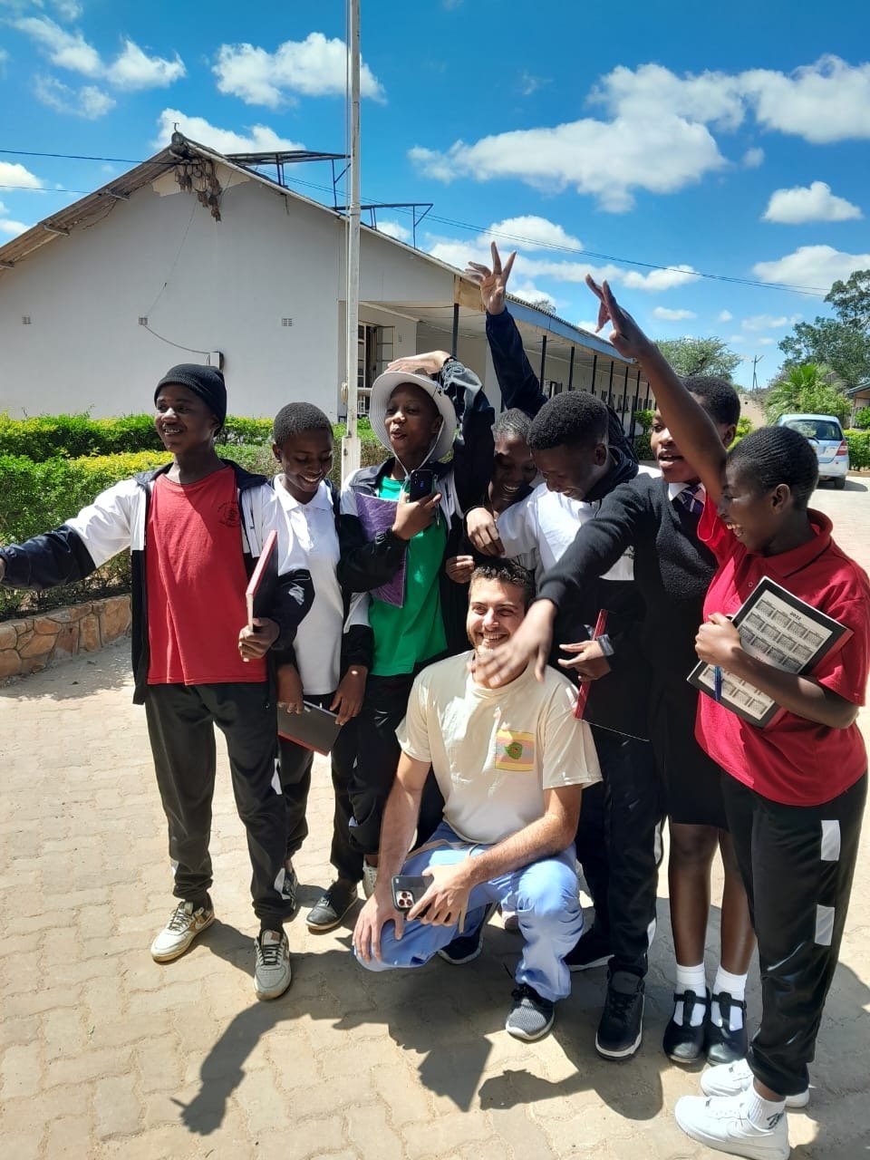 H4H volunteer team celebrating with community members after a mission