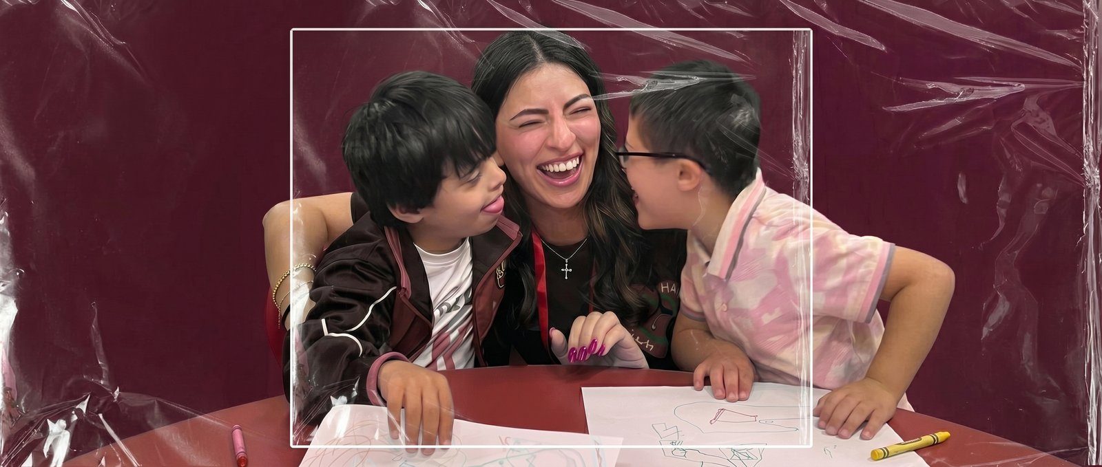 H4H volunteer sharing a joyful moment with children at a community outreach event