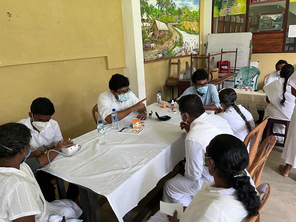 Medical volunteer consulting with a patient